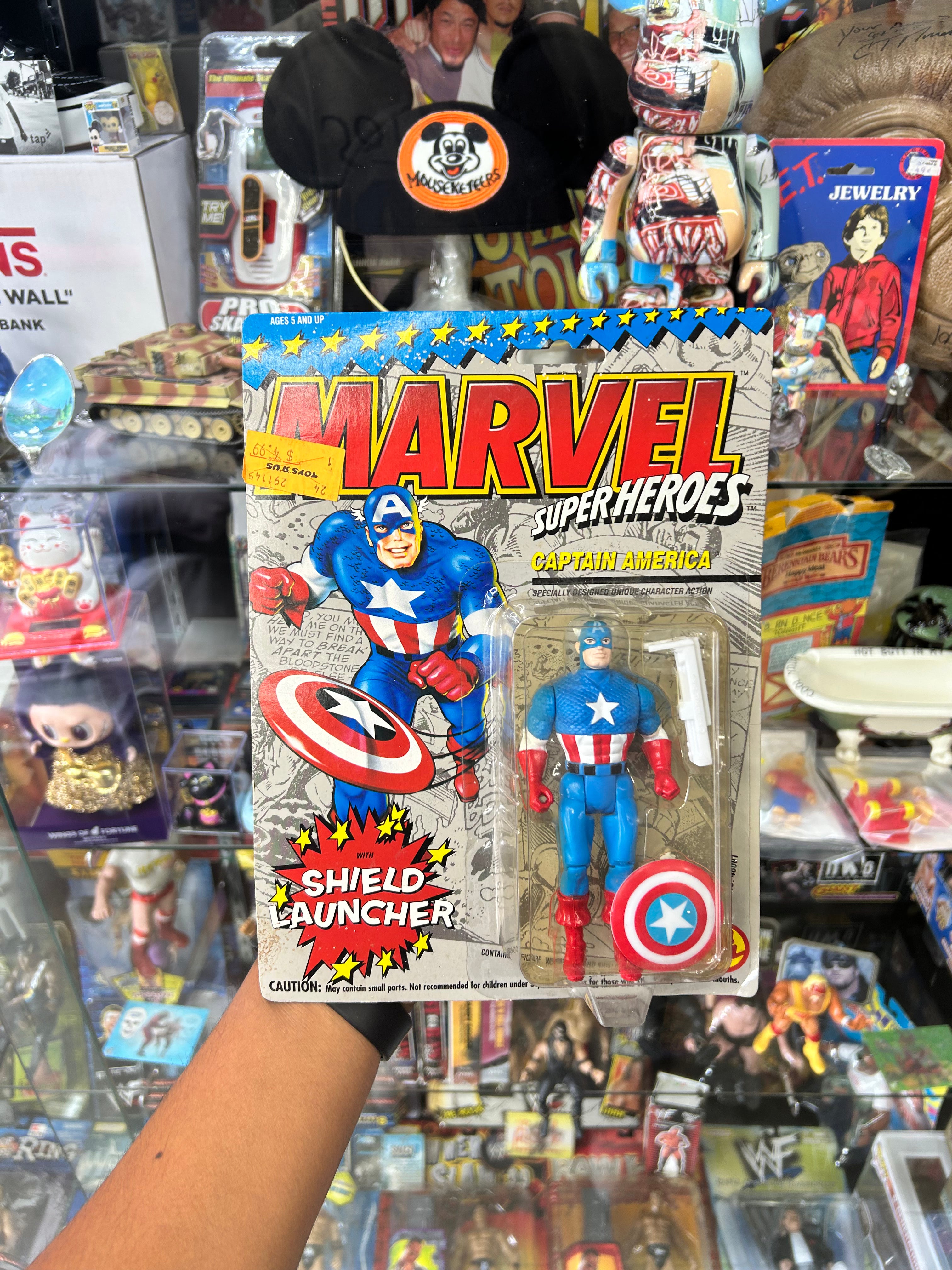 Captain America action figure with a "Shield Launcher" from Toy Biz,  1990